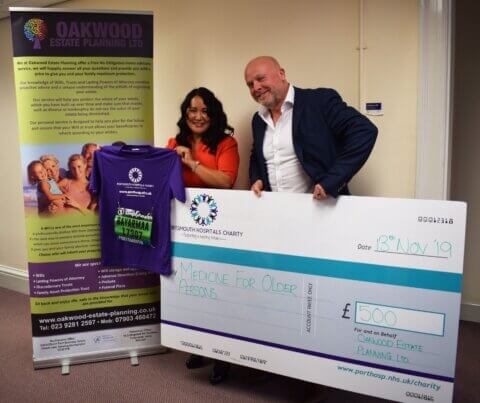 Bayarmaa Howard presenting a £500 cheque to Portsmouth Hospitals Charity